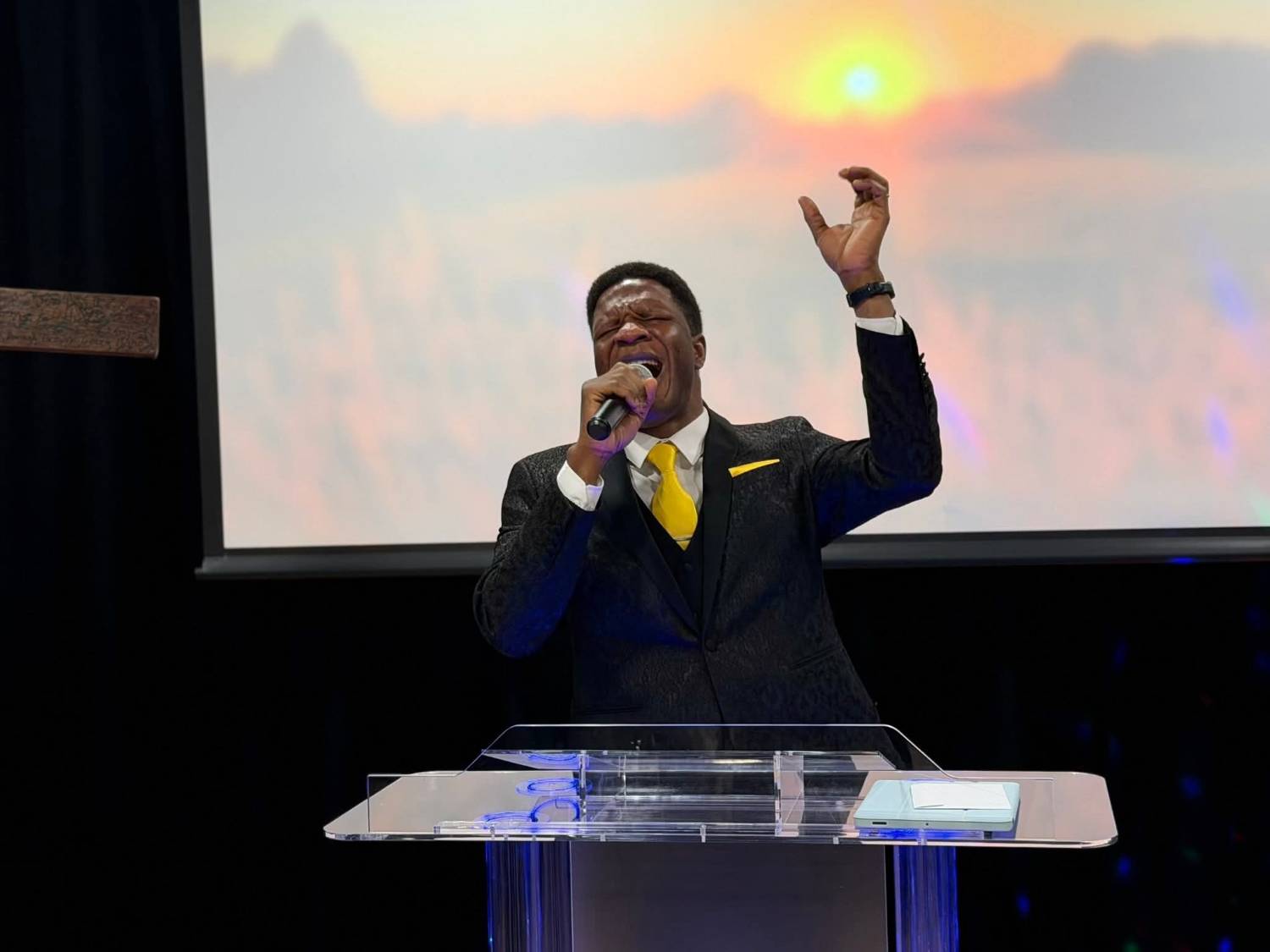 Pastor Brawn Obaweki leading worship