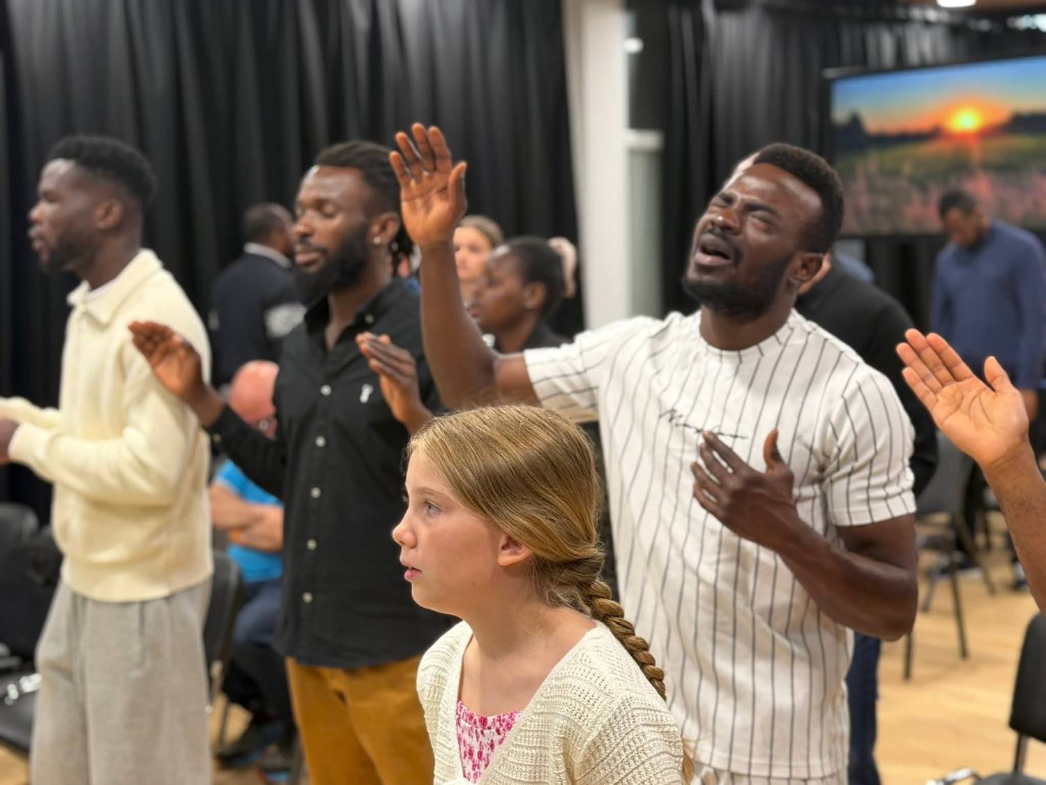 EBM members worshipping together